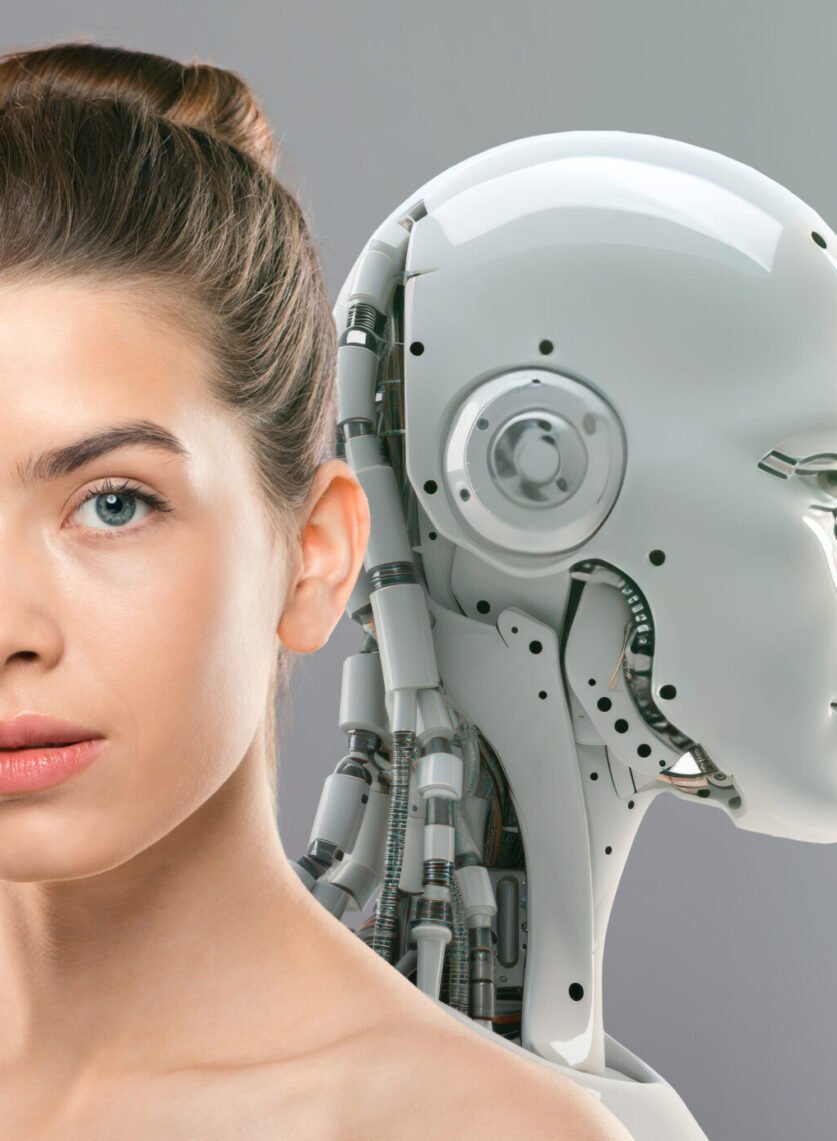 Innovations of beauty industry. Close up portrait of young gorgeous lady with perfect face and skin posing to camera with artificial robot, grey studio background, free space