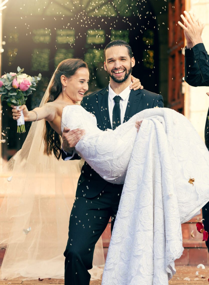 Wedding, love and man carrying woman outside church fo celebration of loving vows. Commitment and r.