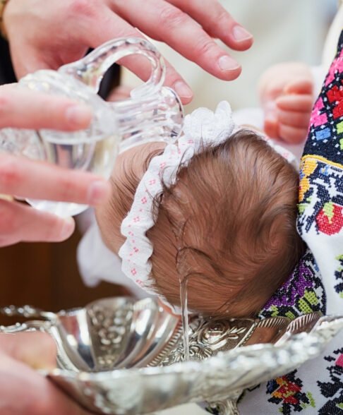 Christening newborn in Orthodox Church. Baby christening.