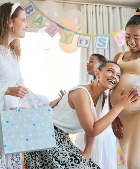 Shot of a pregnant mother to be receiving gifts from her friends at her baby shower.