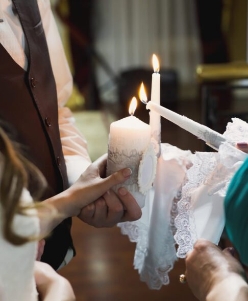 Wedding ceremony, paraphernalia, the bride and groom hold a large candle in their hand